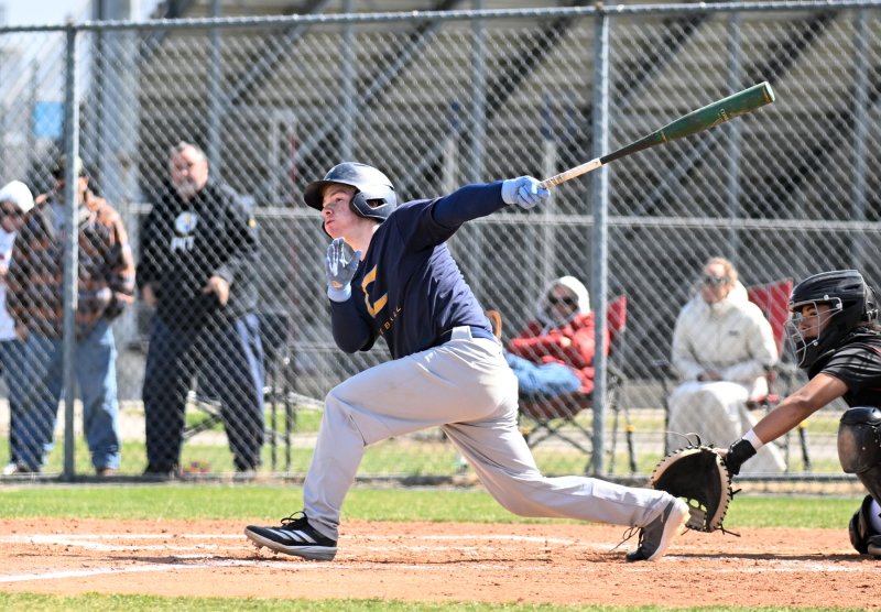 Junior Aaden Johnson slams a hit to left.