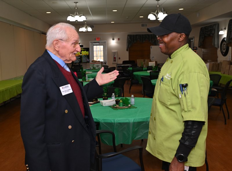 CHEER Board President Walt Koopman, left, speaks about the meals with CHEER Dietary Director Ricky Pitts.