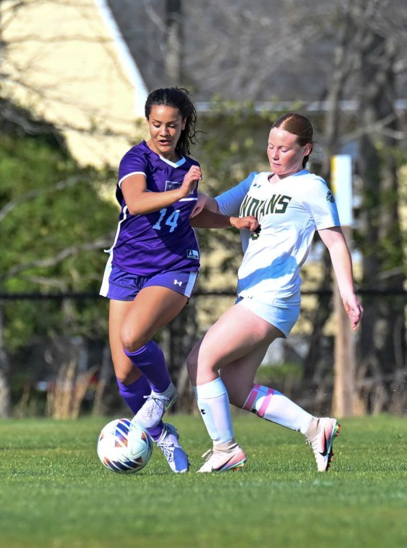 Royals freshman Anaiah Mulhern battles for possession with IR’s Grace Clark.