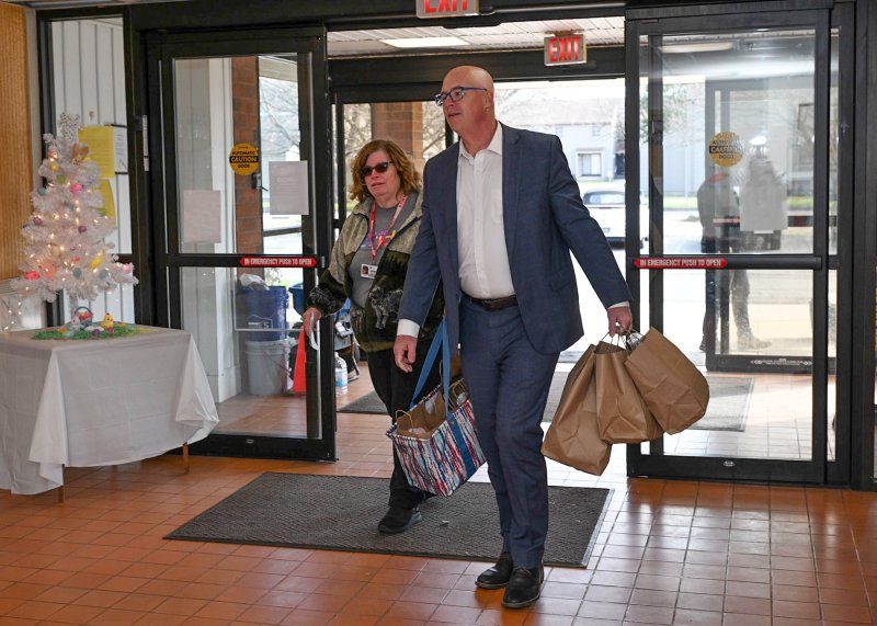 Sen. Russ Huxtable along with volunteer Karen Fernandez delivered meals to recipients in Milton.