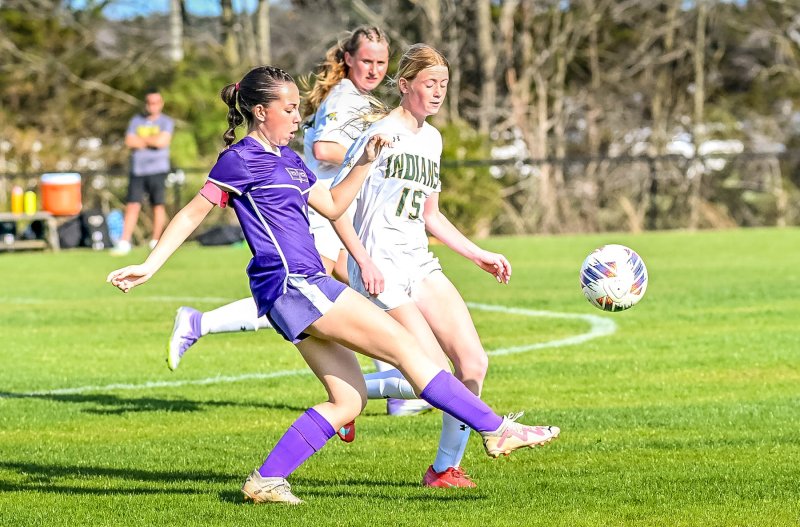 Royals senior Haley Jones boots the ball past IR’s Hayden Benner.