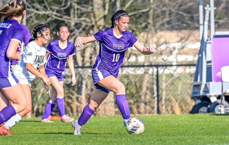 Royals sophomore Morgan Stevenson speeds the ball through the midfield.