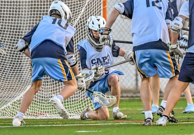 Cape senior keeper Mason Trench makes a save and makes the cover.
