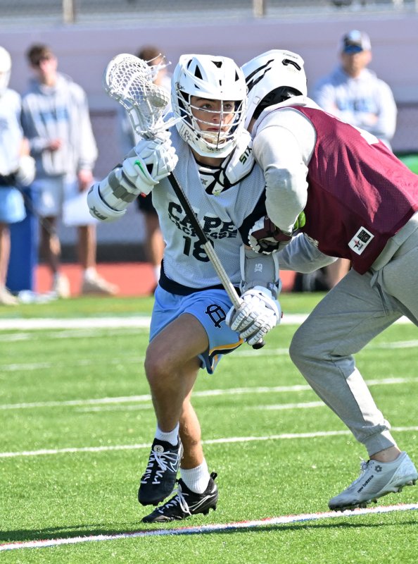 Cape senior Grant Conway bull dodges through a Ridgewood defender.