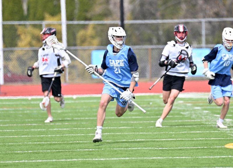 Cape junior long pole Drew Mongeluzo clears the ball from the Maroons’ offensive zone.