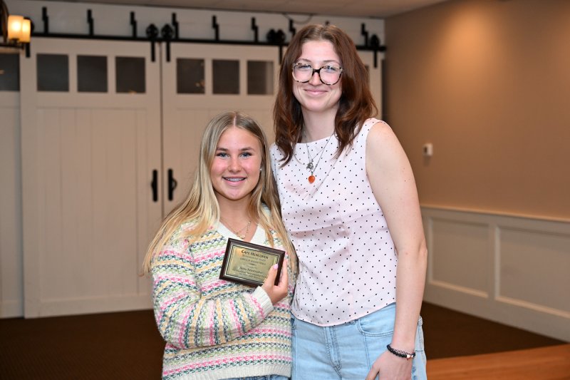 Vikings JV coach Carlin Quinn presents the JV Sportsmanship Award to Anna Neustadter.