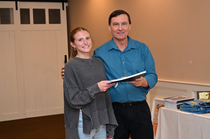 Amara Fruchtman receives the senior award from coach Ron Dukes.