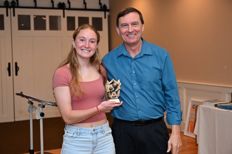 Junior Mairead Rishko receives the Sportsmanship Award from coach Ron Dukes.