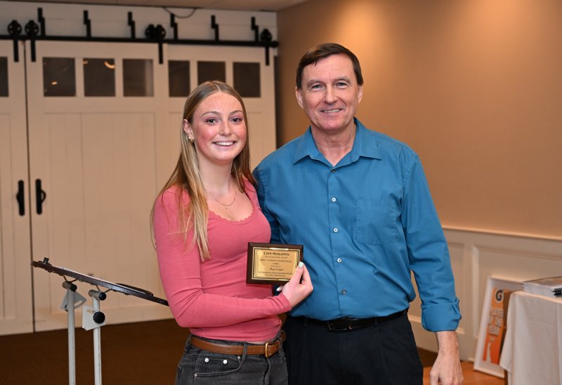 Senior Maya Yngve receives the team Sportsmanship Award from coach Ron Dukes.