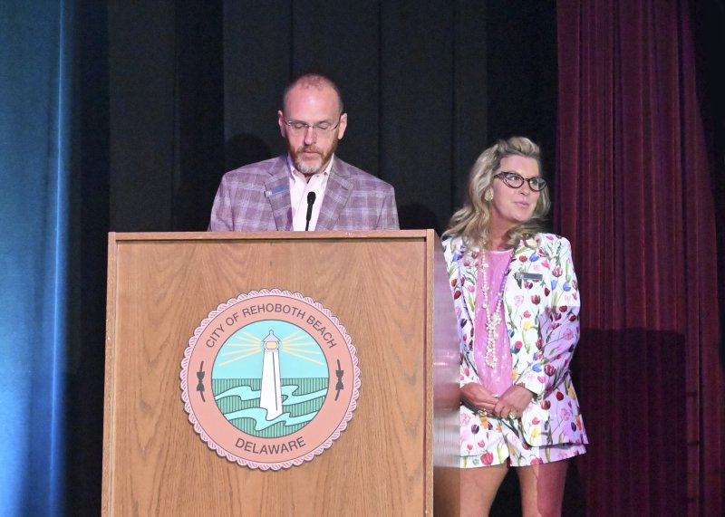 Terry Kistler, left, and Jen Carroll of Rehoboth Beach Main Street welcome the crowd to the Runway 2024 event. FILE PHOTO