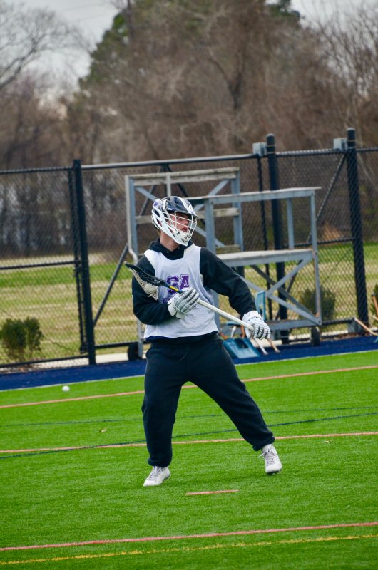 Sussex Academy junior Jack “Taco” Meszaros pulls the ball out during an offensive drill.