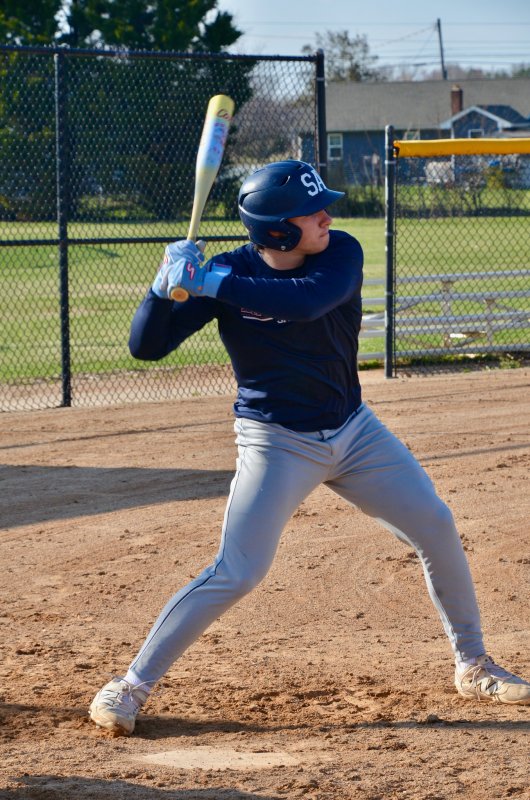 Sussex Academy sophomore Mason Glover begins his weight transfer during live batting practice.