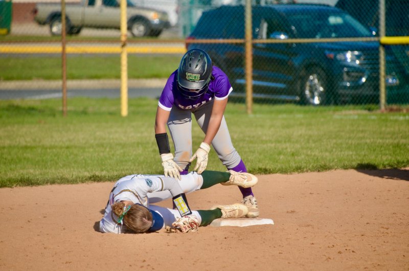 Royals freshman Grace Hicks checks on senior Addelyn Clark after the two collided.