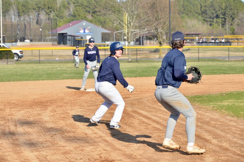 Seahawks junior Derek Sachs forces a rundown on a slow roller to third base.