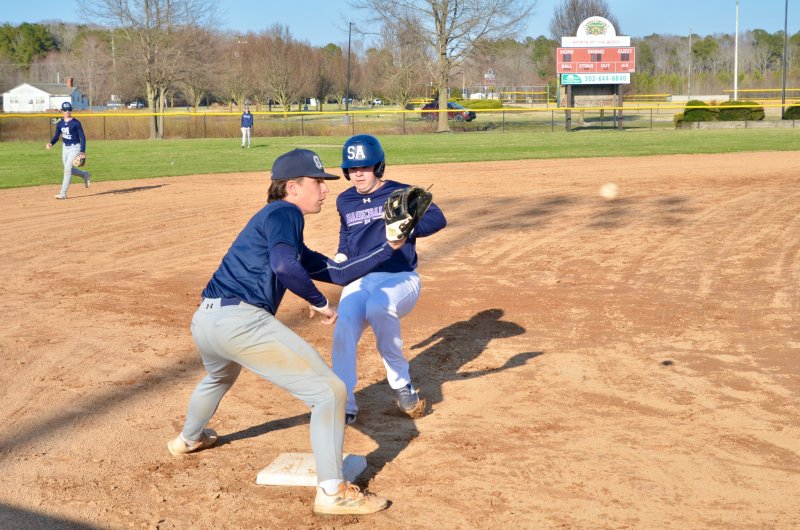 Sussex Academy junior Derek Sachs takes third during live batting practice.