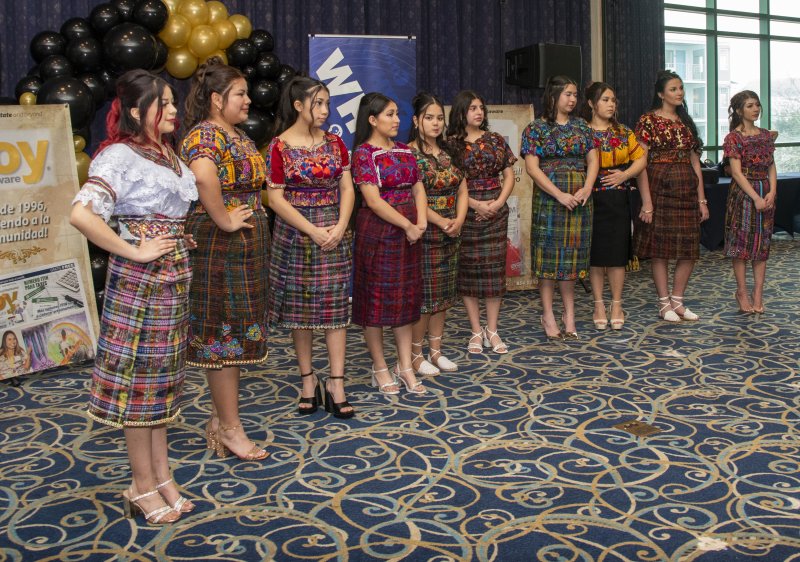Guests from Guatemala wear traditional Guatemalan Mayan blouses known as huipiles and wrap skirts called cortes.