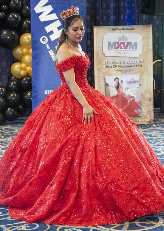 Sofia Castillo poses with her red gown and bejeweled tiara.