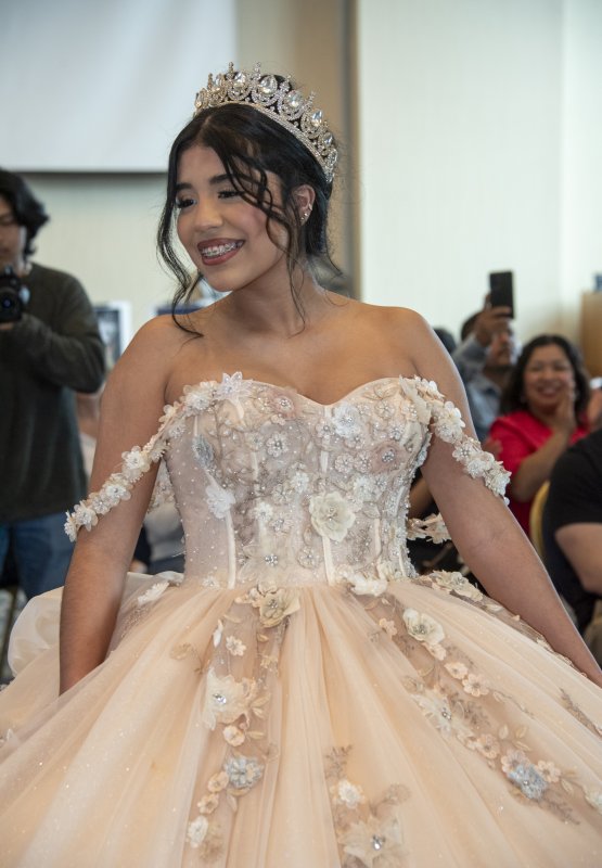 Ailyn Mercado beams at the audience from the runway.