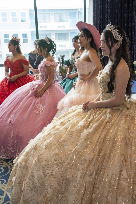Quinceañera gowns fill the room at the expo.