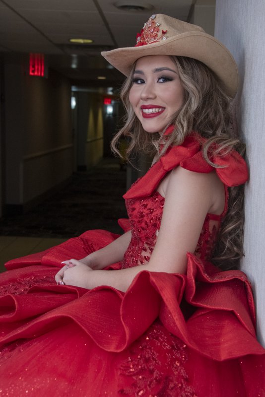 Michelle Pinto pauses in the wings before her Quinceañera reveal in the fashion show.
