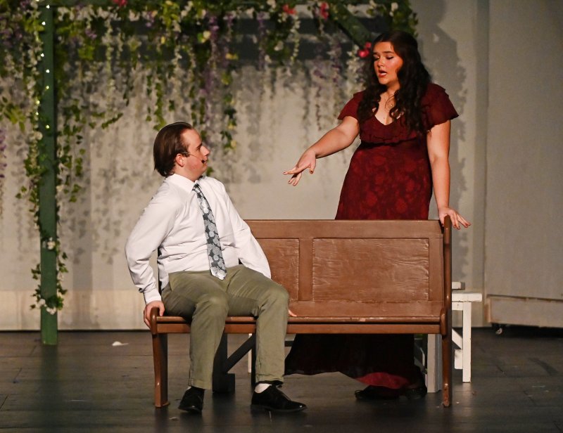 Sharing the stage for “Take A Chance On Me” are Anna Currence as Rosie and Noah Lewis as Bill.