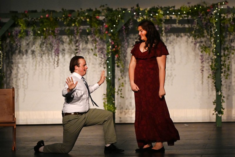 Sharing the stage for “Take A Chance On Me” are Anna Currence as Rosie and Noah Lewis as Bill.