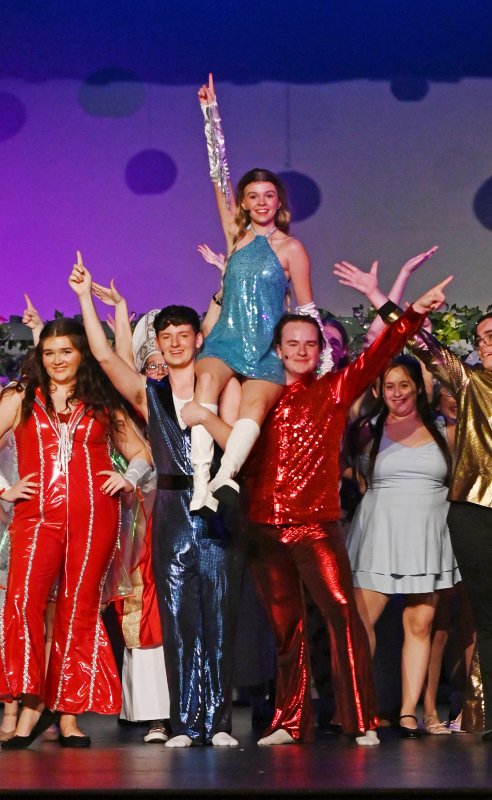 The cast poses at the conclusion of the show.