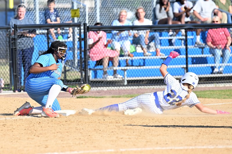 Cape sophomore third baseman Jordynn Bowe just misses the tag on Central’s Ava Brock.
