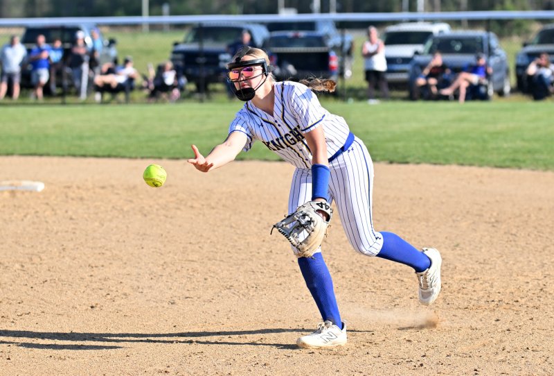 Central junior Ava Brock tosses to first for an out.