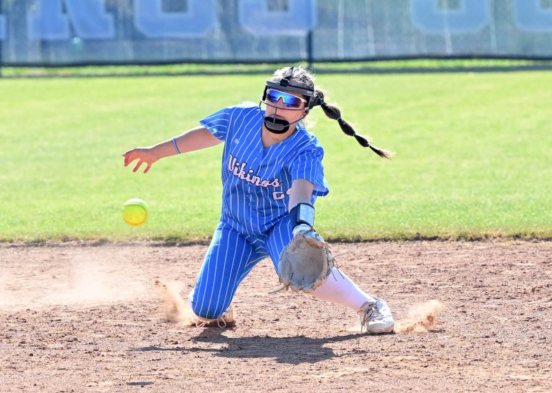 Freshman shortstop Riley Windish makes a diving play and snags a line drive for an out. DAN COOK PHOTOS