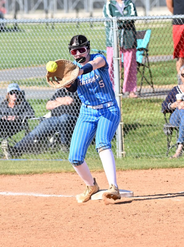 Cape junior first baseman Madilynne O'Malley gets a throw for an out.
