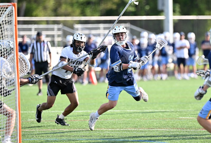 Cape senior Ryan Morgan gets major air to pepper the twine in the 19-1 victory over the Ravens. DAN COOK PHOTOS
