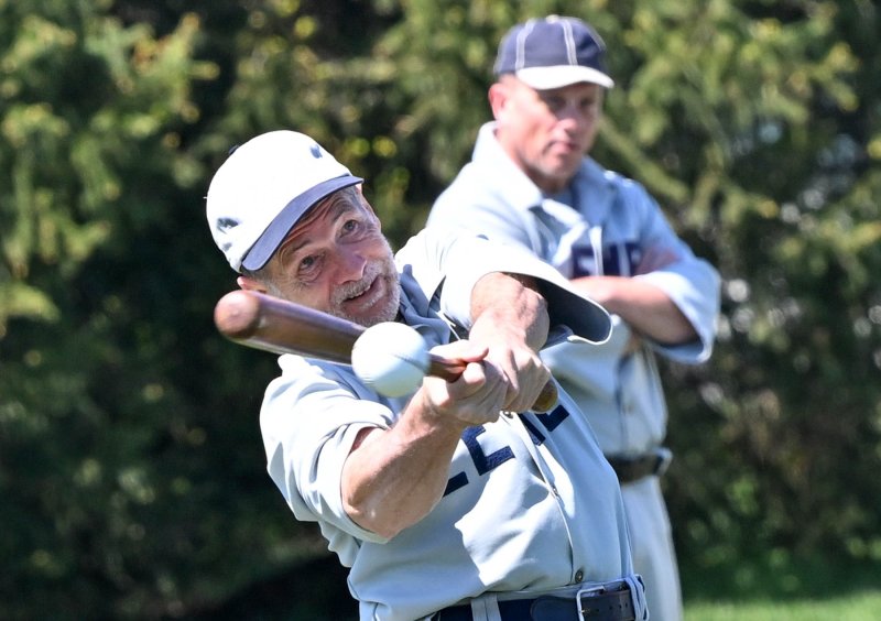 Lewes Base Ball Club’s John “Cheese” Chisholm slams a hit in the first inning.