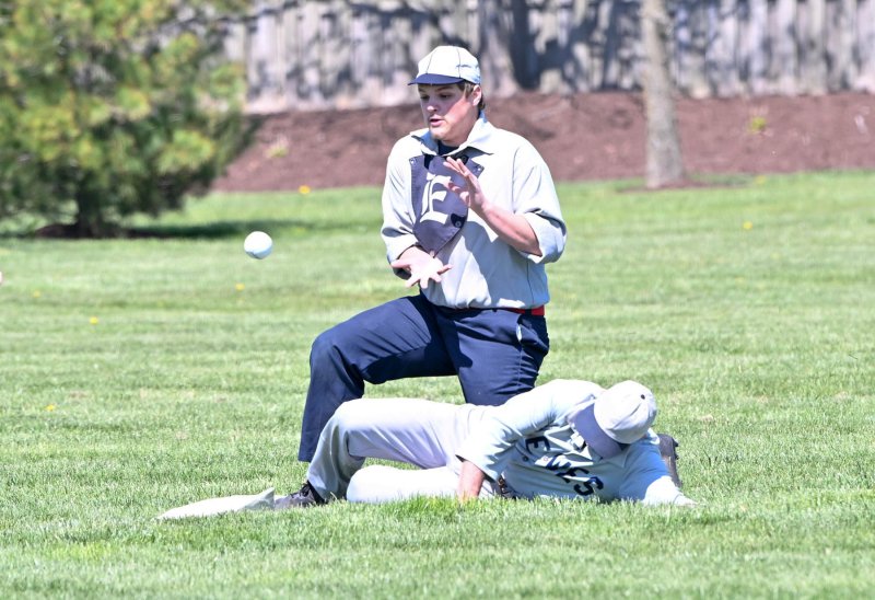 Lewers baserunner John “Cheese” Chisholm slides safely into second.
