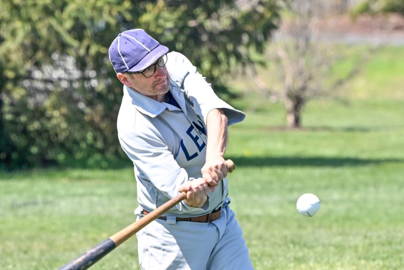Lewes Base Ball Club captain Mike "Oyster" DiPaolo slams a hit into left field.