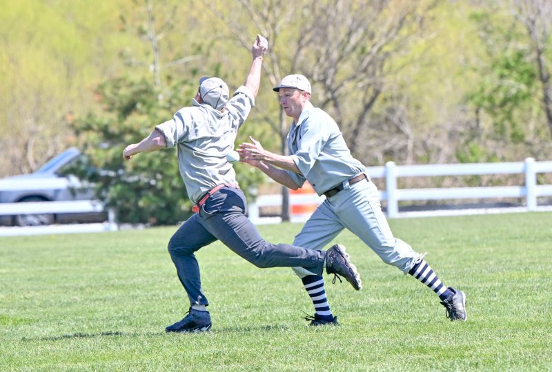 Lewes player Grant “Ulysses” Garrity, right, gets an out on a rundown.