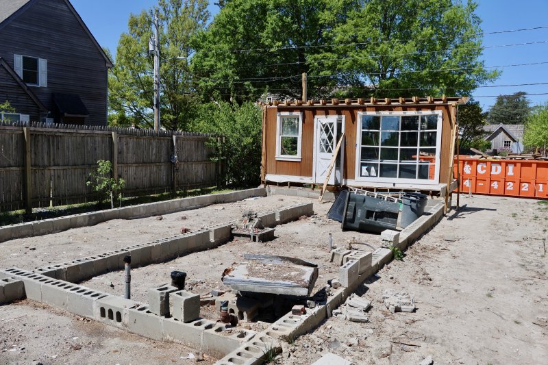The view from the rear of 311 Park Ave., with the original foundation in the foreground. The partial stop-work order means nothing can be done at this part of the property. Work can continue on a new structure behind the old foundation.
