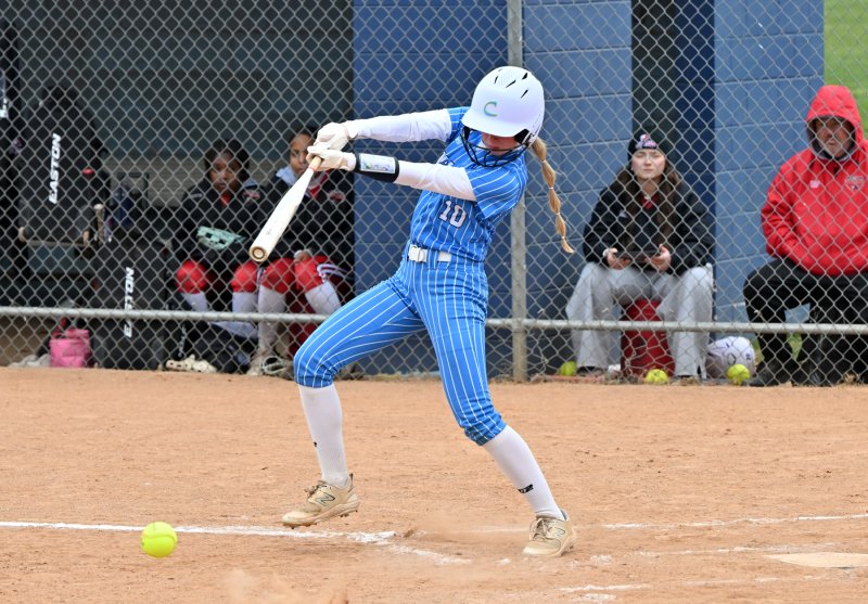 Olivia Mekulski gets on base with a slap hit.