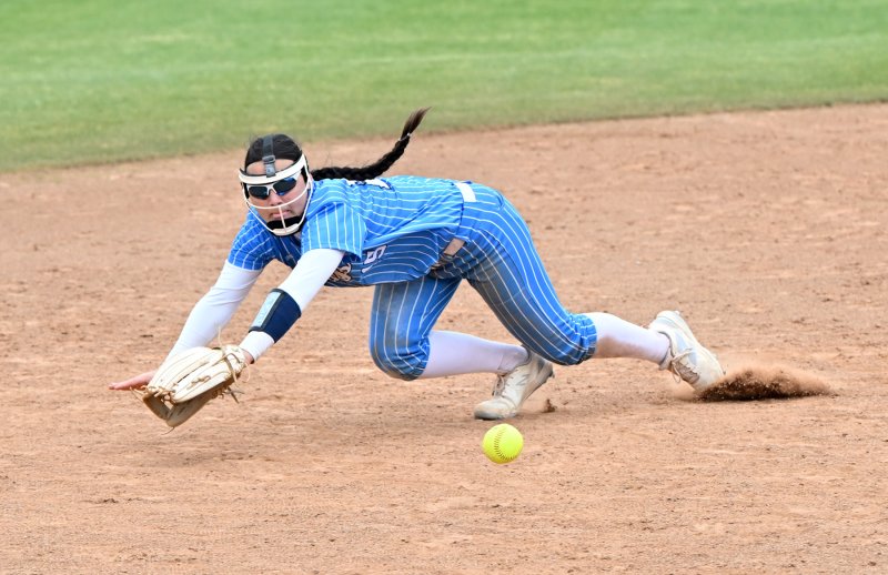 Freshman Makaila Sellers makes a diving play on a grounder at short.