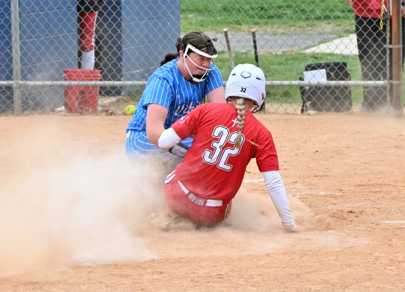 Sara Craig puts the tag on Red Lion’s Anna Wallace.