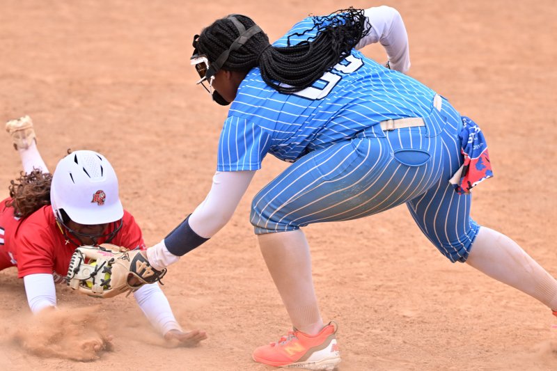 Cape third baseman Jordynn Bowe puts the tag on a base runner.