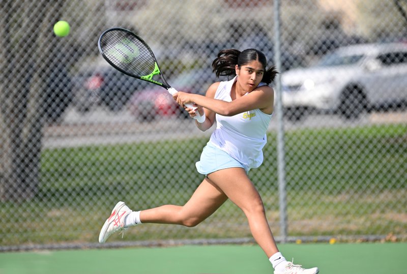 Cape first-doubles player Riti Patel slams a backhand in her win with partner Anika Sehgal Sekhri. DAN COOK PHOTOS