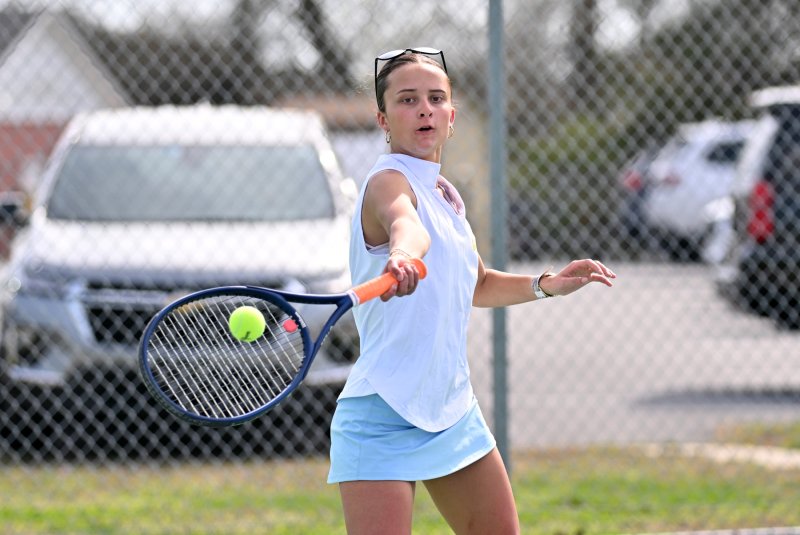 Madeleine Ruffcorn whacks a forehand drive at second doubles.