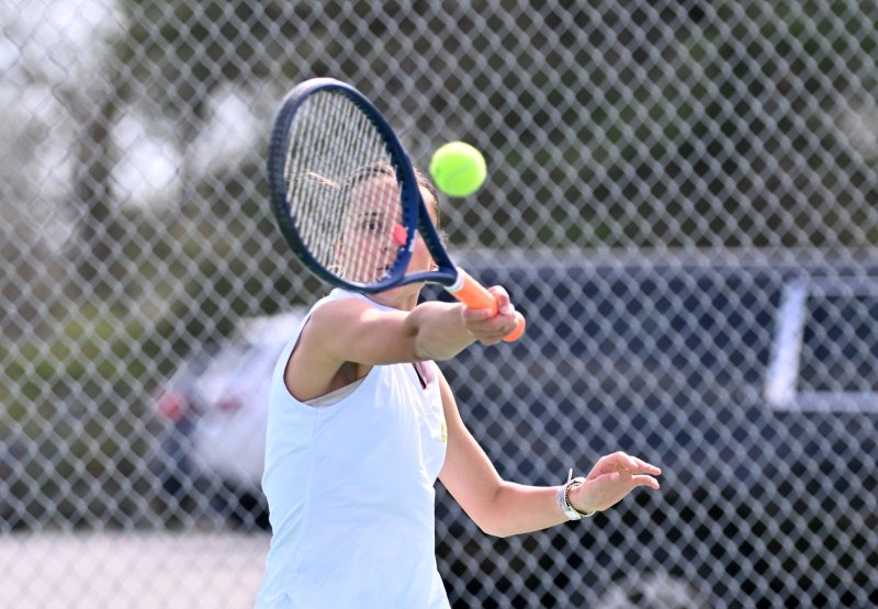 Madeleine Ruffcorn blasts a forehand in the second-doubles win.