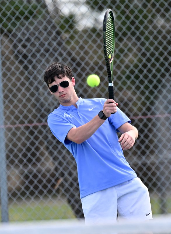 Sullivan Naden slams a forehand drive at second singles.