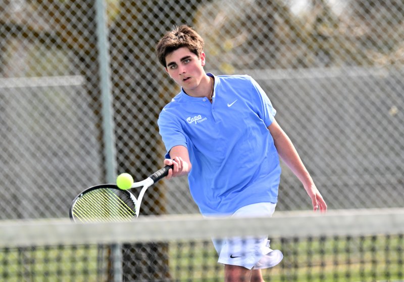 Michael Gordon pops a forehand volley.