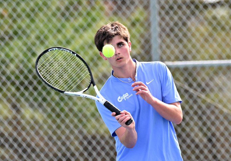 Michael Gordon pops a forehand volley.