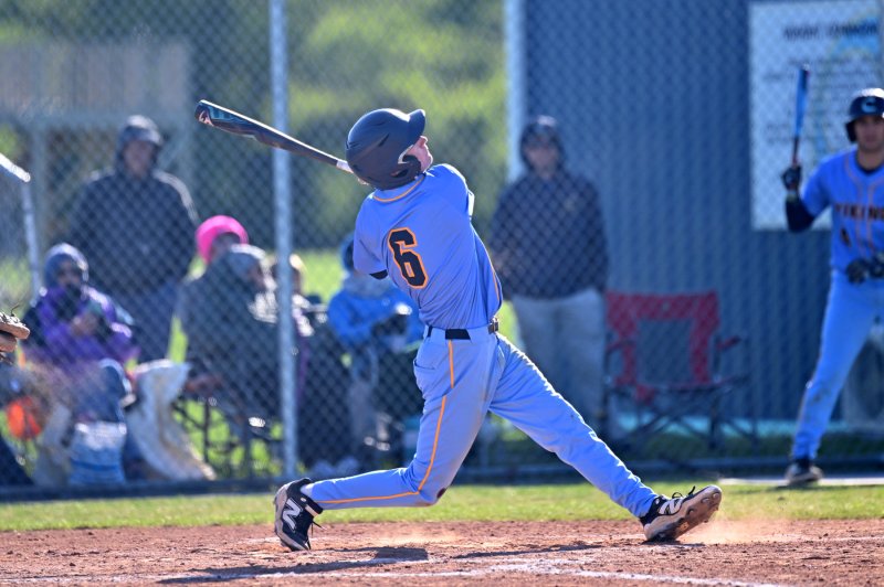 Cape junior Nick Clampitt slams a ball into the outfield.