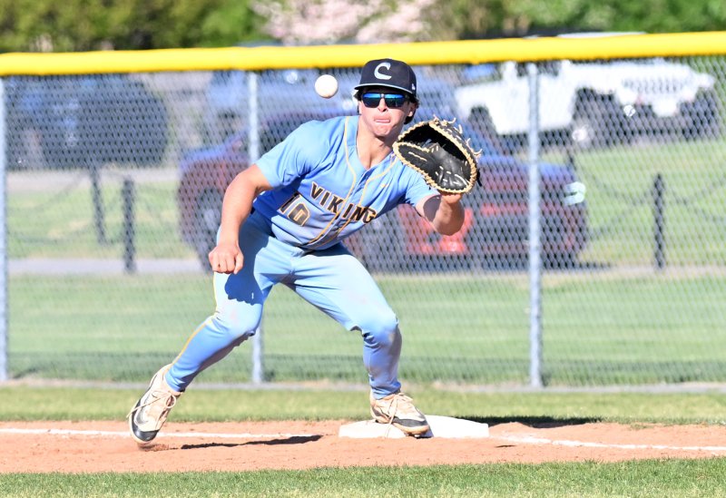 Cape senior first baseman Max Selders snags a Joe Ruark throw for an out.
