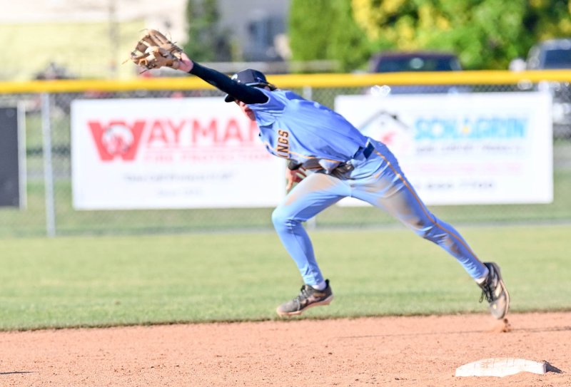 Cape second baseman Triz Willey shows his range running down a liner for a catch and throws to first for a double play.